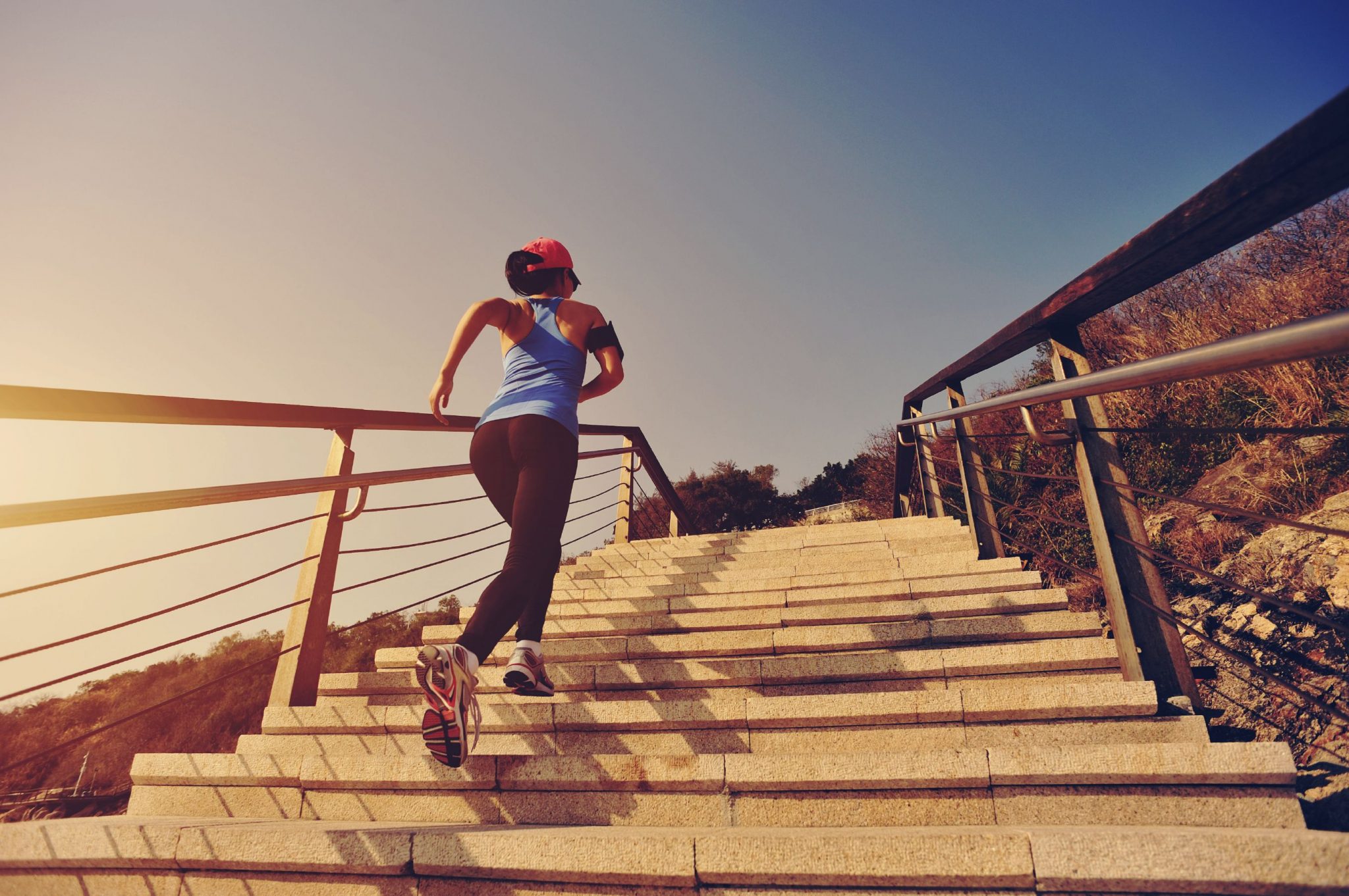 healthy-lifestyle-sports-woman-running-up-on-stone-stairs-000066321315_Large-compressor